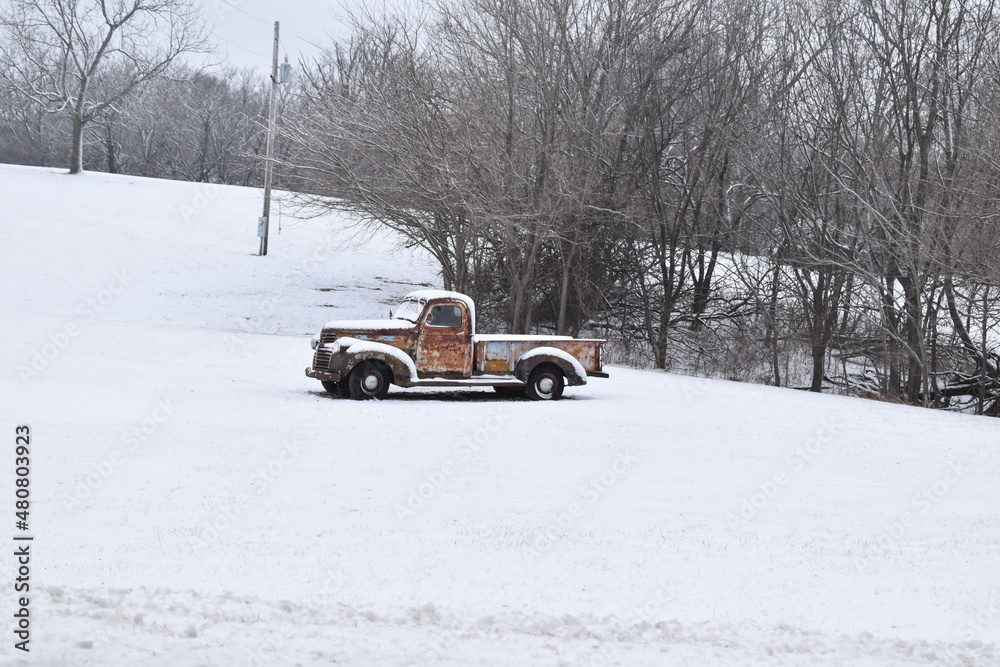 Canvas Prints antique truck in a snowy field