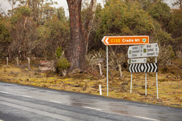 Road intersection with road signs at the turnoff to Cradle Mountain