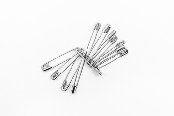 Pins or paper clips to remind you of objects on a white background