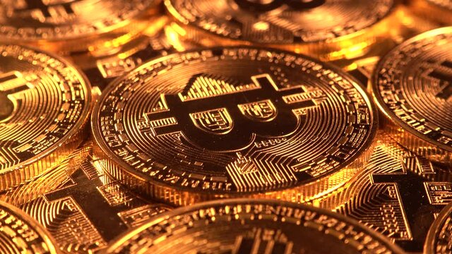 Bitcoin coins rotating close up. Crypto currency background
