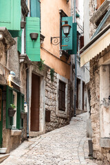 Narrow, stone paved, old streets of Rovinj, Croatia, filled with colorful, stone built houses