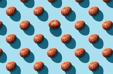 Pattern of easter eggs on green pastel background