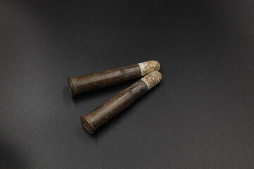 Old cartridges for rifle on black background