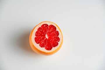 Fototapeta na wymiar red ripe grapefruit isolated on white background