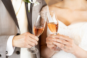 The bride and groom are toasting