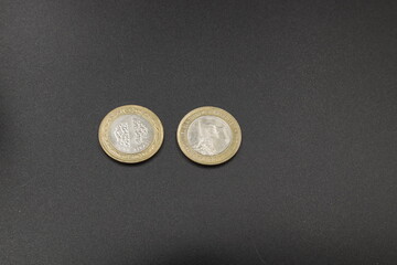 Turkish coin on black background