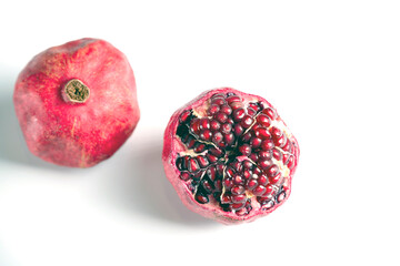 red ripe pomegranate on white background