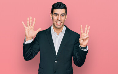 Handsome hispanic man wearing business clothes showing and pointing up with fingers number eight while smiling confident and happy.