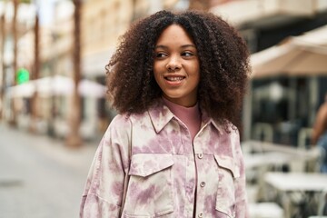 Young african american woman smiling confident standing at street