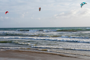 Water sport at cold winter water of Tyrrhenian sea between two touristic towns Sperlonga and Terracina in Lazio, Italy