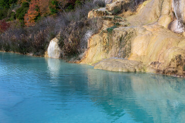 Ancient hot thermal springs and blue pool in nature park Dei Mulini, Bagno Vignoni, Tuscany, Italy