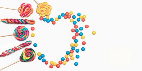 The heart image created with colorful candies and bonbons is suitable for use as Valentine's Day and greeting cards.