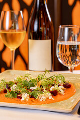 Piquillo Yogurt Sauce topped with Candied Almonds, Frisee, Goat Cheese and Pickled Beets