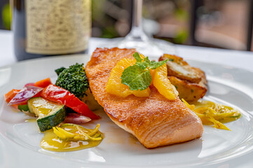 Grilled Salmon with Vegetables topped with orange slices