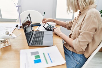 Young caucasian woman working at office