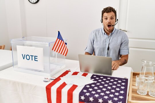 Handsome Young Man Working At Political Campaign Wearing Operator Head Seat Scared And Amazed With Open Mouth For Surprise, Disbelief Face