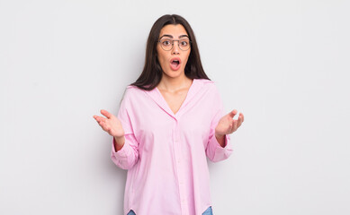 pretty young woman open-mouthed and amazed, shocked and astonished with an unbelievable surprise