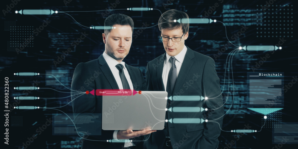 Aufkleber two attractive european businessmen using laptop with abstract glowing big data blockchain interface