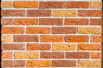 Texture of colorful red brick wall. For backgrounds and backdrops