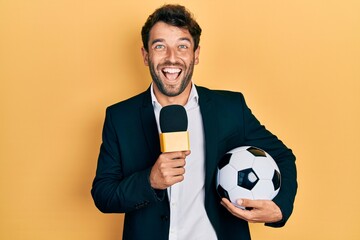 Handsome man with beard football reporter microphone celebrating crazy and amazed for success with...