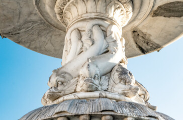 Fototapeta na wymiar Detail of the fountain of the Young Fisherman (Fontana del Pescatorello), sculpted in the 19th century, in Duomo square, Prato city, Tuscany region, Italy