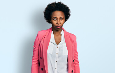 African american woman with afro hair wearing business jacket skeptic and nervous, frowning upset because of problem. negative person.