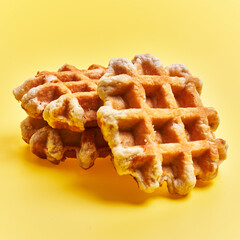  Bunch of delicious waffles over yellow background