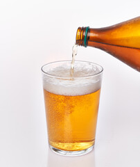  Pouring beer on glass isolated over white background