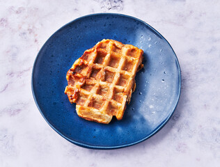  Plate of delicious waffle on marble surface
