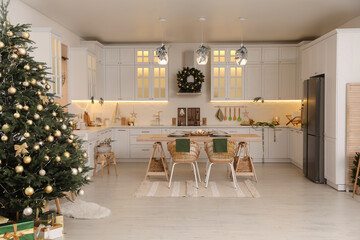 Cozy open plan kitchen decorated for Christmas. Interior design