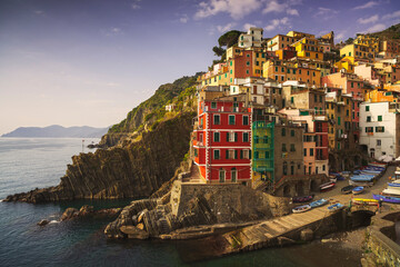 Fototapeta na wymiar Riomaggiore old town, cape, colorful houses and sea. Cinque Terre, Liguria, Italy