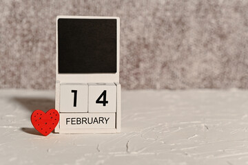 February 14 date on wooden calendar. label with place copy space