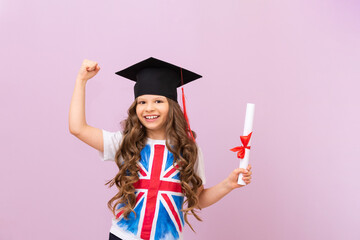 A joyful schoolgirl is very happy to receive a certificate of obtaining knowledge of a foreign...