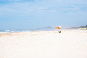 Fototapeta na wymiar Beach Umbrella on a Beach in a Summer Day.Vacation Concept.Copy Space