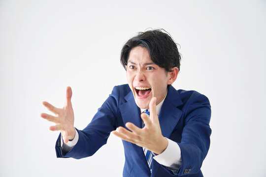 ビジネスマン　怒り　白背景