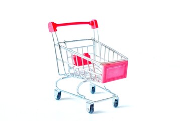 Shopping cart in supermarket is empty on white background.