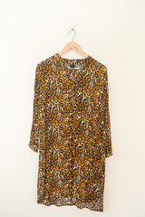 beautiful leopard print shirt hanging on wall