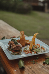 Gastronomic meal of roasted beef accompanied by fried flatbread and salad