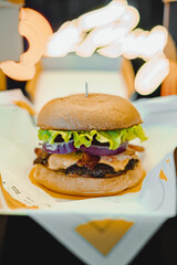 Delicious hamburger with various ingredients ready to enjoy