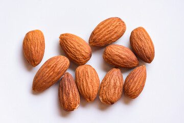 Almonds on white background top view on the table, Close up roasted almond nuts natural protein food and for snack