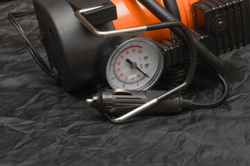 portable car pump for wheels, powered by 12 volts