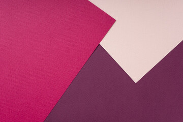 Geometric composition of colored textured paper in pink and coral shades. Creative abstract background, flat lay, top view, copy space, mockup. Fashionable minimalistic concept. Color trends