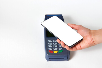 Woman using NFC technology for payment terminal