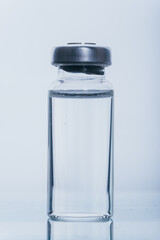 Glass medical ampoule vial for injection. Medicine is dry white drug penicillin powder or liquid...