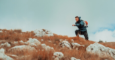 A male hiker trail running on the mountain extreme sport outdoor.