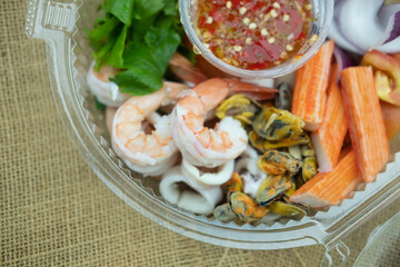 Tasty seafood salad such as shrimp, squid, mussels, fresh vegetable in box
