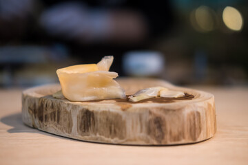Pickled ginger placed on wood dish in japan restaurant