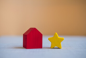 Yellow stars and a red wooden house. The best housing.
