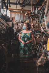 Portrait of woman standing in junkyard 