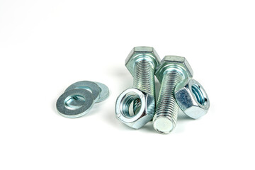 several metal bolts with washers and nuts on a white background. close-up